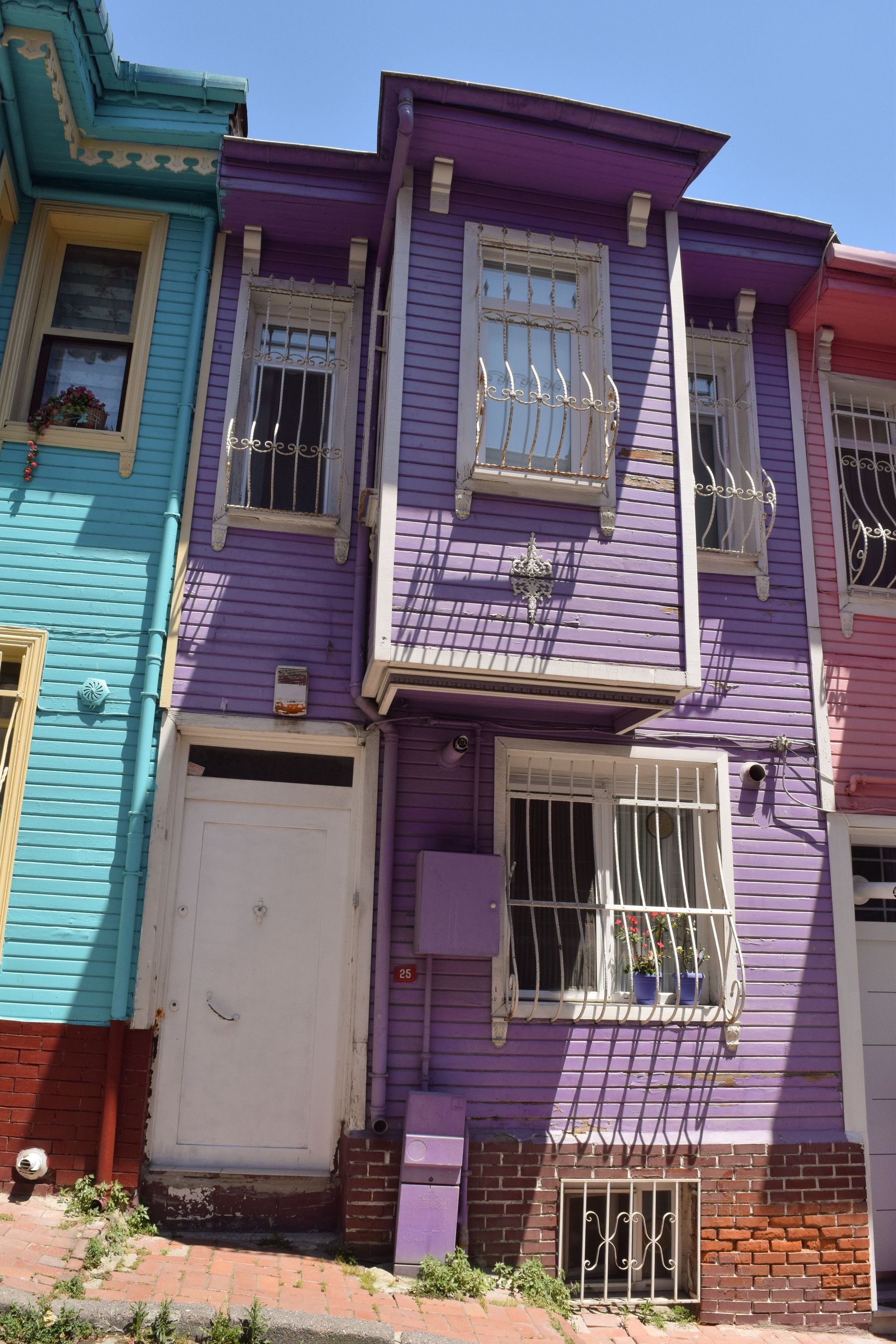 Brightly painted row houses with ornate architectural details and colorful exteriors.